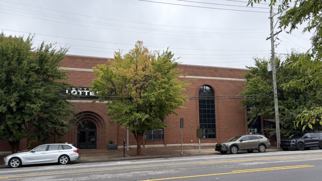 Kentucky Lottery headquarters on West Main Street in Louisville, with Marker No. 2205 at the curb